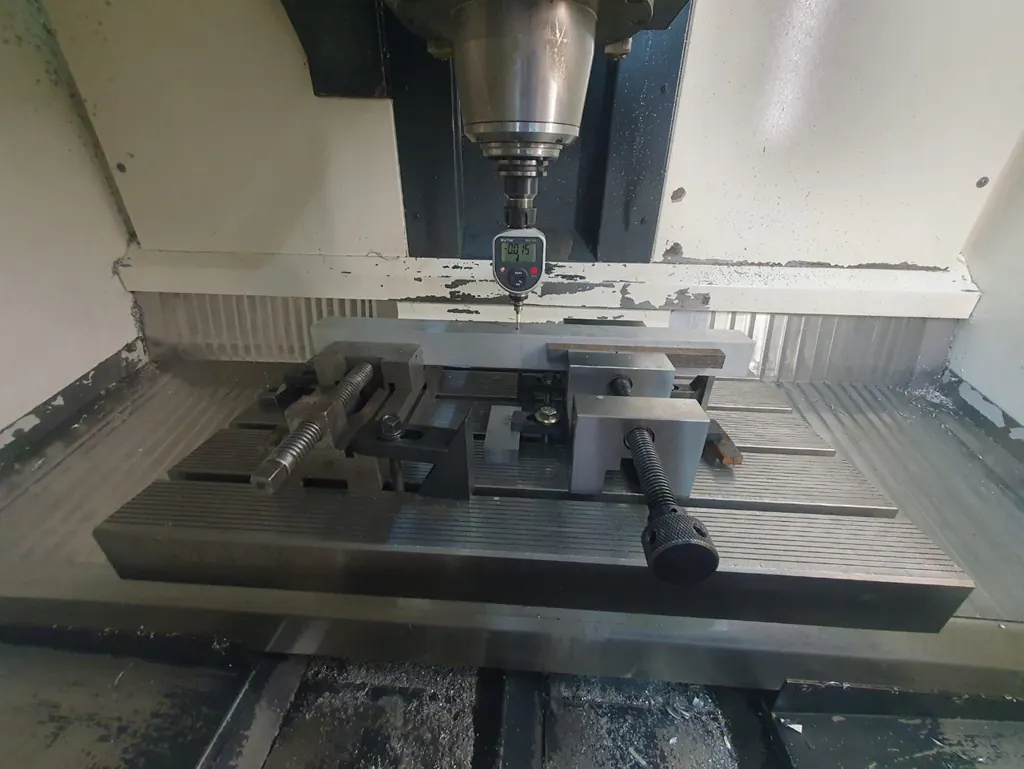 Workpiece clamped in a vice on a CNC milling machine table