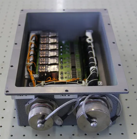 Assembled junction box with relays and sealed circular connectors
